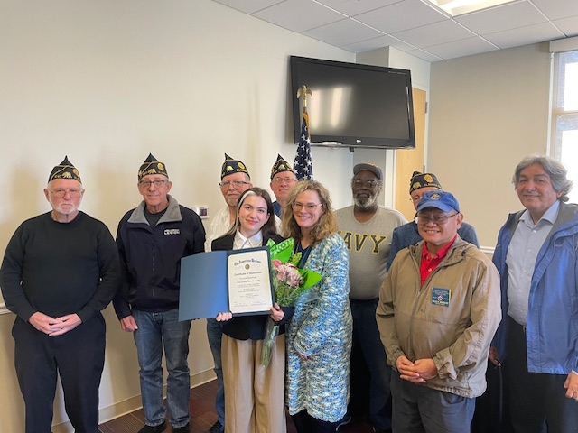 Members of Post 647 standing with 2025 U.S. Constitution Oratorical Area 2
                                contestant winner, Sylvie Karlstrand